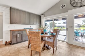 Enjoy meals in the kitchen with ample counter space and dining area with a round table.