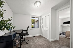 Work in comfort with a desk, computer, and natural view.