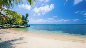 On the beach, sun loungers, beach towels