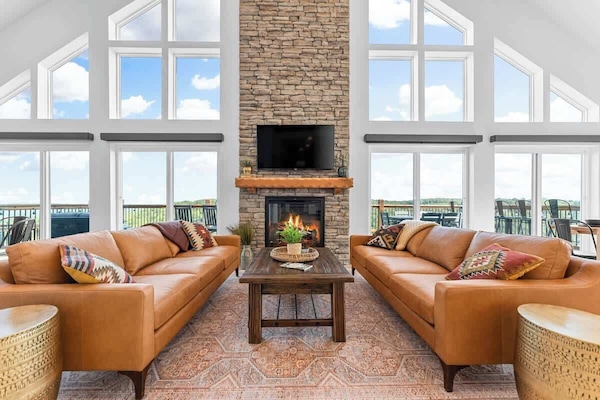 Large Family Room with floor to ceiling windows (with a great view), and cozy seating
