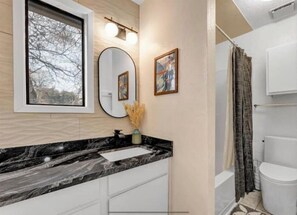 Shower, towels, soap, toilet paper