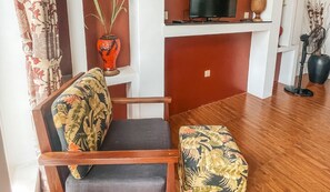 Deluxe Double Room | Living area | Flat-screen TV, toys - The Bygone (Siem Reap)