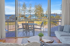 Relax and work in style with a comfortable sofa and scenic views from the balcony.