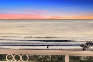 Enjoy breathtaking ocean views from this balcony overlooking the beach.