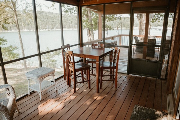 Enjoy meals, morning coffee, or game nights from the screened porch with beautiful lake views.