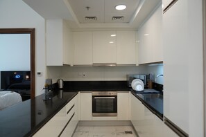 Appartement Design | Cuisine privée | Réfrigérateur, micro-ondes, four, plaque de cuisson