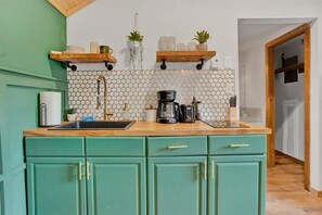 Fridge, microwave, stovetop, coffee/tea maker