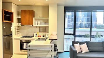 Family Apartment | Private kitchen | Full-sized fridge, microwave, oven, stovetop