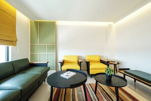 Urban Suite | Living area | 43-inch LCD TV with cable channels, books - INDIE STAYS JAIPUR (Jaipur)