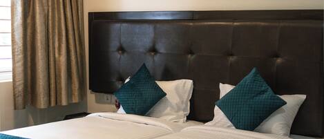 Individually furnished, desk, laptop workspace, bed sheets