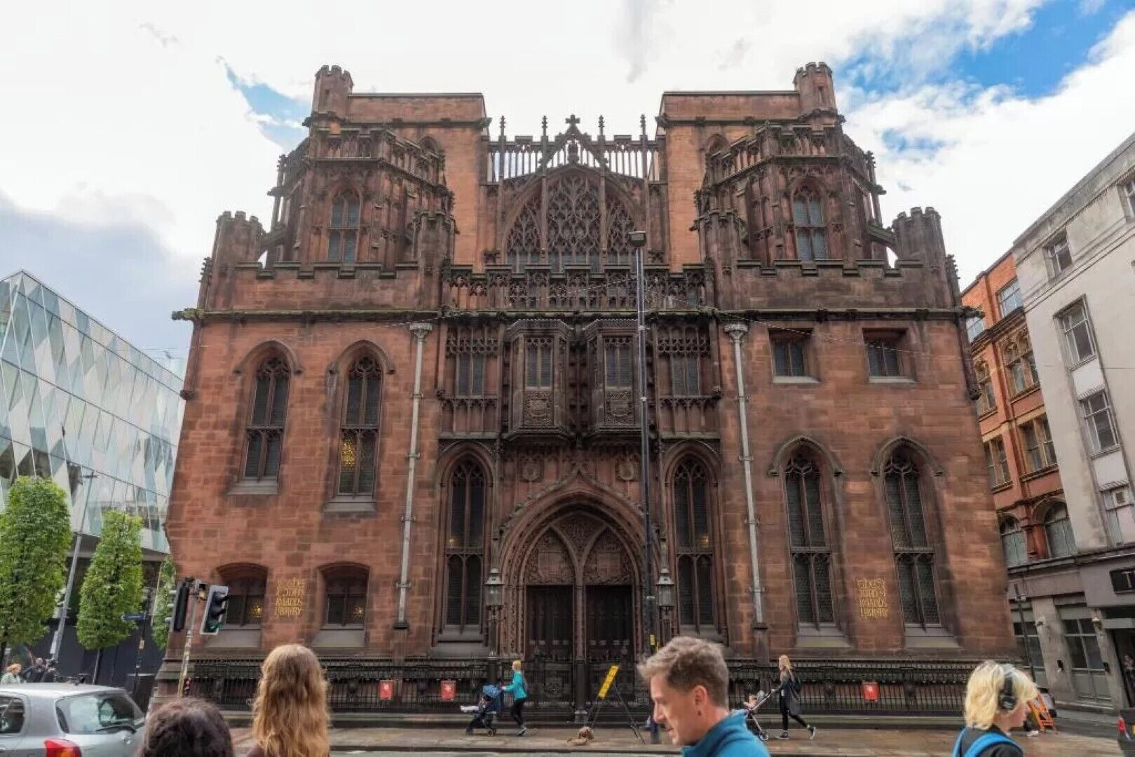 A historic building with Gothic architecture, featuring pointed arches and intricate stonework.