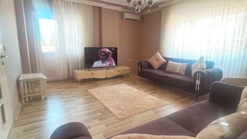 Apartamento família | Área de estar