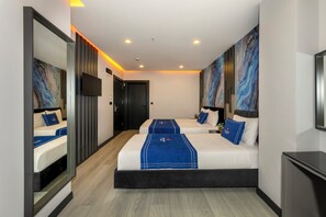 Minibar, coffres-forts dans les chambres, bureau