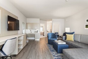 Desk, laptop workspace, bed sheets