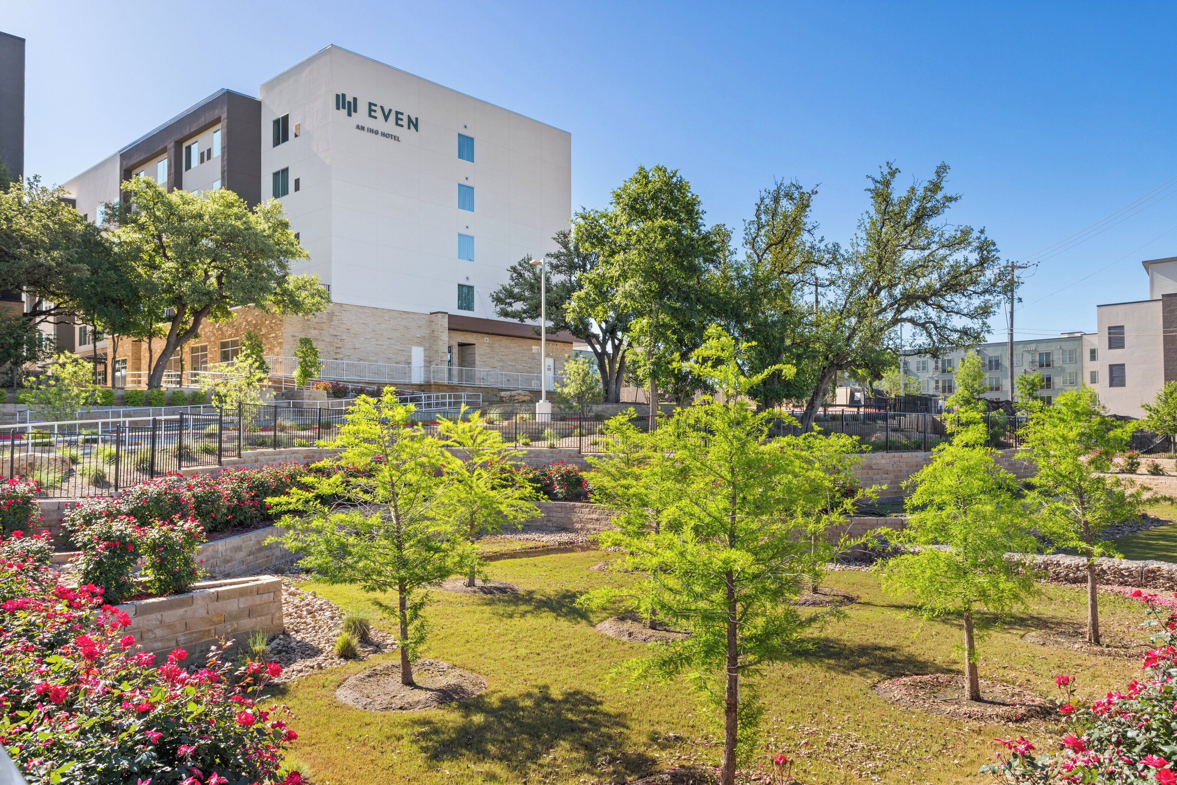 A hotel with a modern design, featuring a prominent 'EVEN' sign on the building.