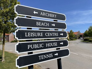Directions to local attractions, including the Archery location, Beach, Leisure Centre, Public House, and Tennis, are clearly marked.