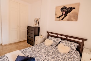 1 bedroom, desk, iron/ironing board, travel cot