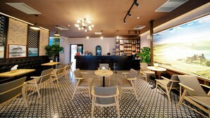 Un restaurante con piso de diseño blanco y negro, una zona de bar y un amplio ventanal con vistas al campo.