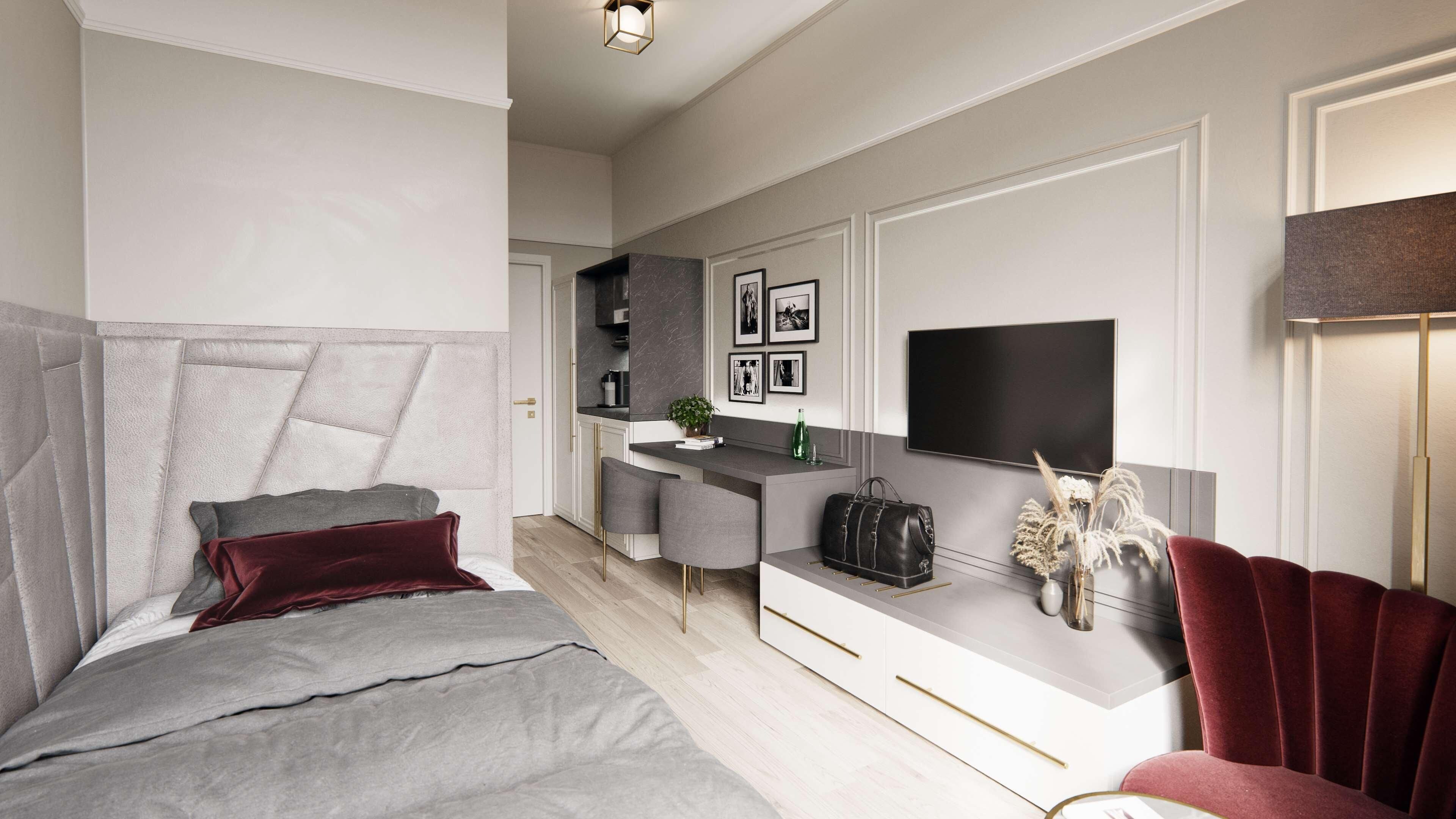 A modern bedroom with a large bed, a desk, and a TV.