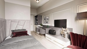 Un dormitorio moderno con una cama grande, un escritorio y una televisión.