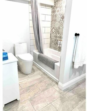 Shower, hair dryer, bathrobes, towels