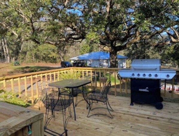 Enjoy al fresco dining on the deck, where a barbecue grill and comfortable seating await.