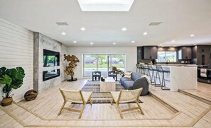 Smart TV, fireplace, books, stereo