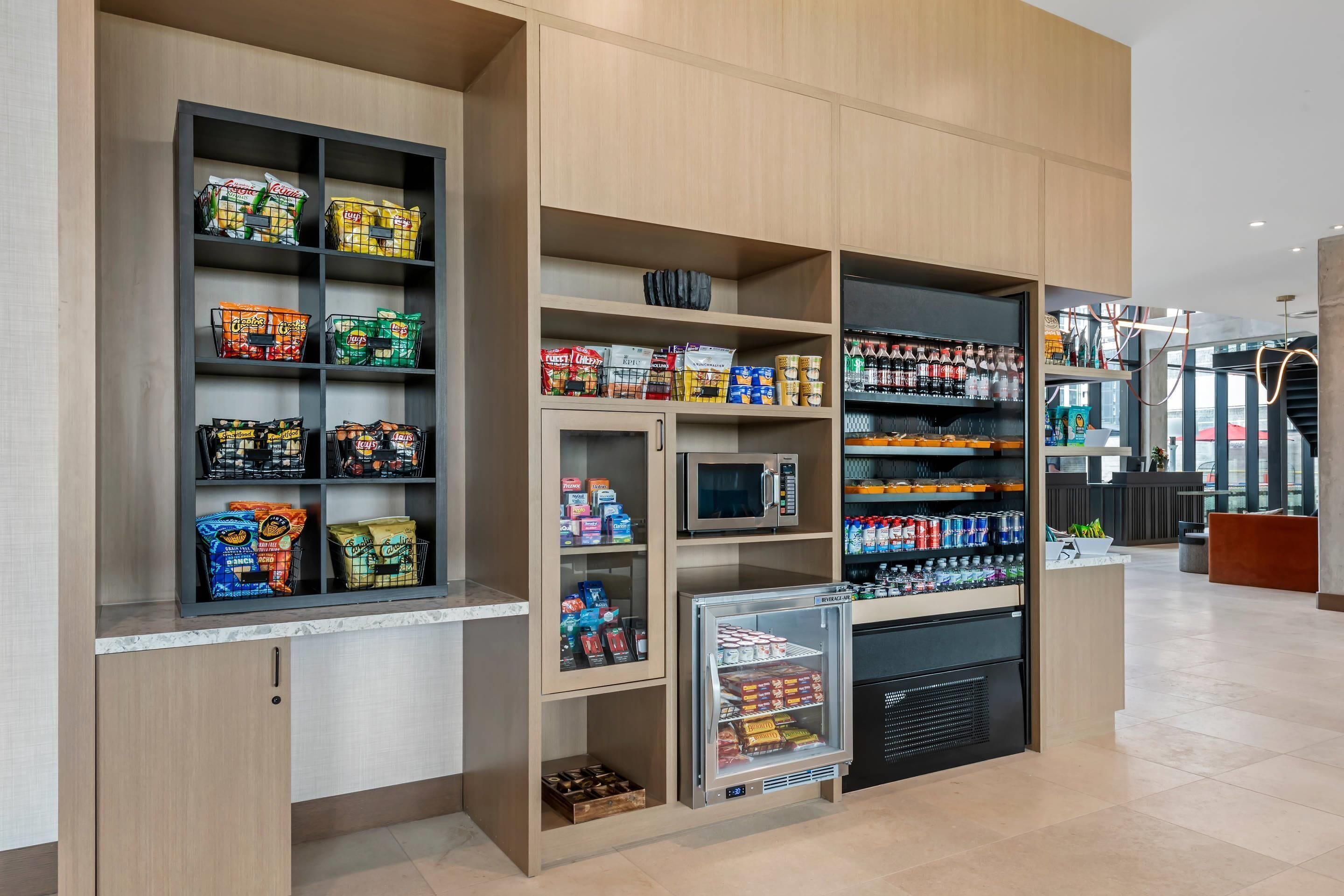 A self-service kiosk with various packaged goods and beverages.