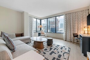 Suite, 1 King Bed, Non Smoking | Desk, laptop workspace, iron/ironing board, travel cot