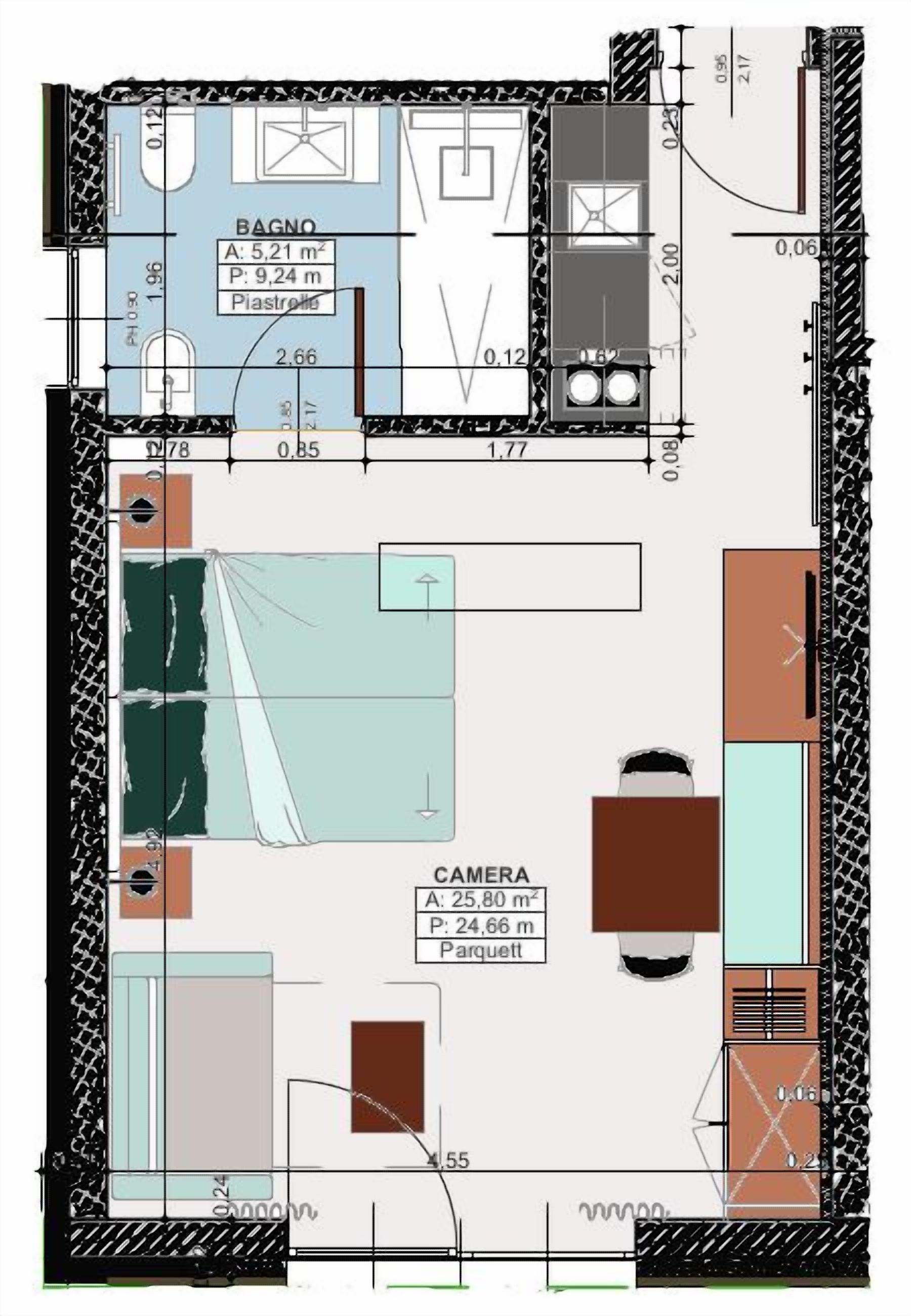 A floor plan of a hotel room with a bathroom, a living area, and a bedroom. The bathroom includes a toilet, sink, and shower. The living area has a sofa and a coffee table. The bedroom has a bed and a wardrobe.