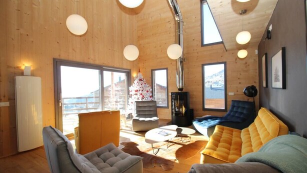 A cozy cabin interior with a fireplace, wooden walls, and large windows. - Chalet Archi, the mountain par excellence (Font-Romeu-Odeillo-Via)