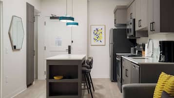 Premium bedding, desk, laptop workspace, blackout drapes