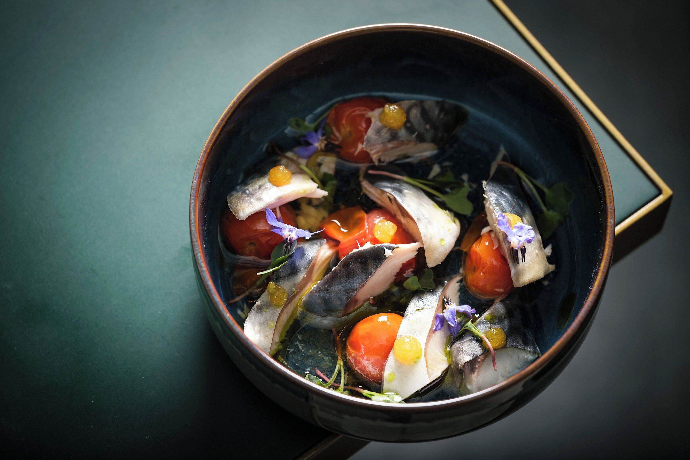 A bowl of seafood salad with various ingredients.