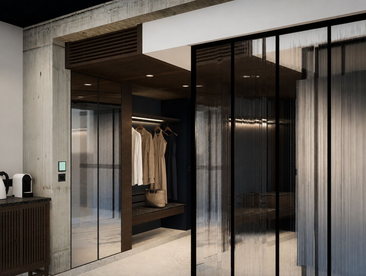 A modern interior with a concrete wall, a clothing rack, and a bench.