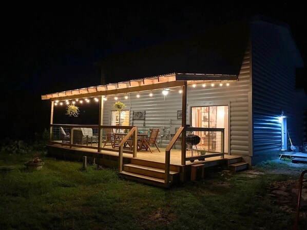 Enjoy al fresco dining on the deck with a grill and outdoor seating.