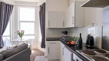 Fridge, electric kettle, toaster, cookware/dishes/utensils