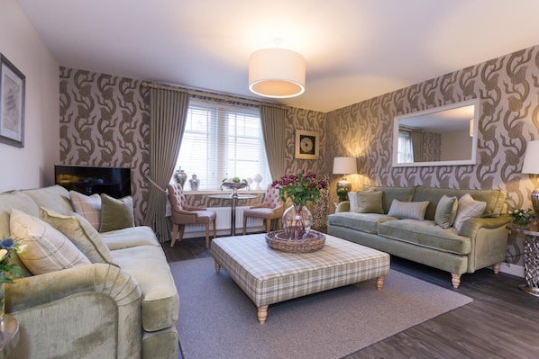 Relax in style with a comfortable seating area and dining space, perfect for social gatherings and leisure.