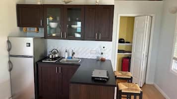 Fridge, stovetop, toaster, cookware/dishes/utensils