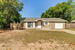 Stroll through the front porch and enjoy the serene surroundings of this single-story home.