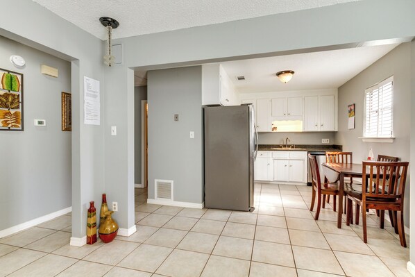 Enjoy meals in the kitchen with a central island, oven, and dining area.