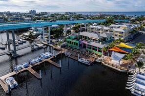 Enjoy scenic ocean views from our waterfront area, featuring a marina, pedestrian bridge, and outdoor seating areas.