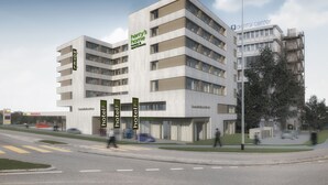 A modern hotel with multiple floors, a flat roof, and a central entrance. - Harry's Home Zürich Limmattal (Spreitenbach)