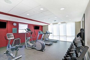 A gym with treadmills, an elliptical, and dumbbells. - Home2 Suites By Hilton Savannah I95 North (Port Wentworth)