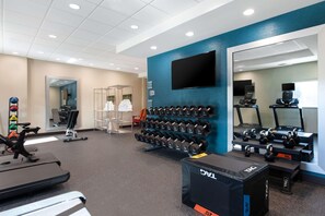 A gym with treadmills, dumbbells, and exercise equipment. - Home2 Suites By Hilton Savannah I95 North (Port Wentworth)