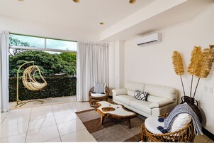 Deluxe Condo | Living area | 50-inch LED TV with digital channels