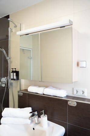 Shower, hair dryer, towels, soap