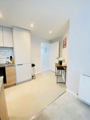 Enjoy a warm and inviting space with an oven, sink, and ample counter space.
