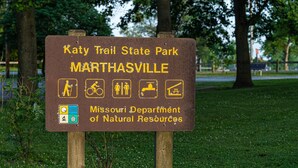 A sign for Katy Trail State Park in Marthaville, Missouri, indicating hiking, biking, and camping activities. - TheOutPostInn Bed&Breakfast - The Purple Victorian (Marthasville)