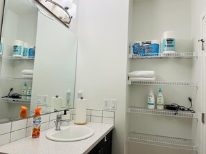 Hair dryer, towels, soap, shampoo