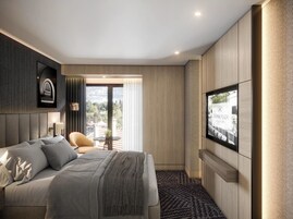 Una habitación de hotel moderna con una cama grande, un televisor montado en la pared y vistas al exterior.
